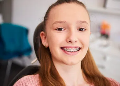 Portrait of smiling child with braces in dentist's office Portrait of smiling child with braces in dentist's office